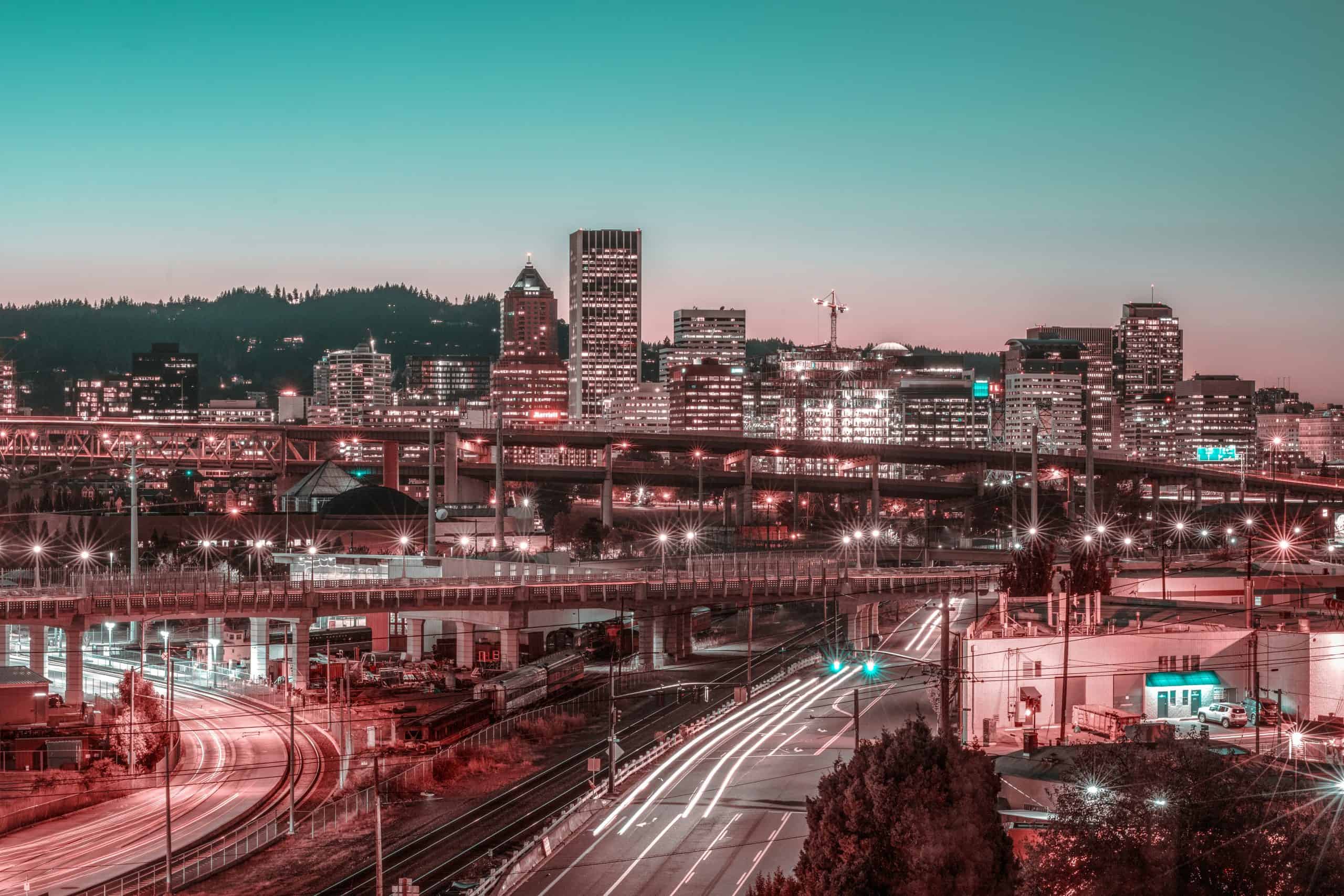 A view of Portland right after sunset that looks out over the city and highways.