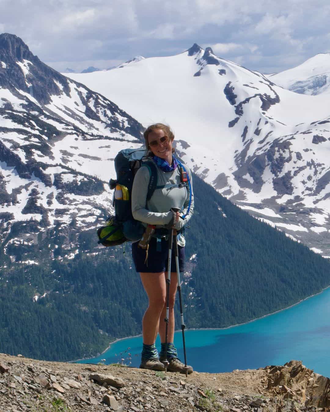 A woman standing on a mountain in Canada.
