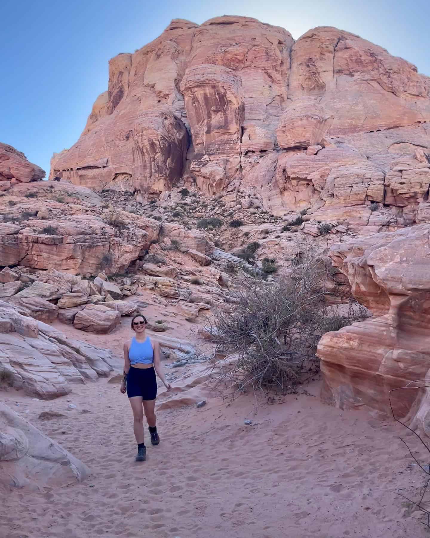 A woman hiking in a canyon in Nevada on a warm summer day.