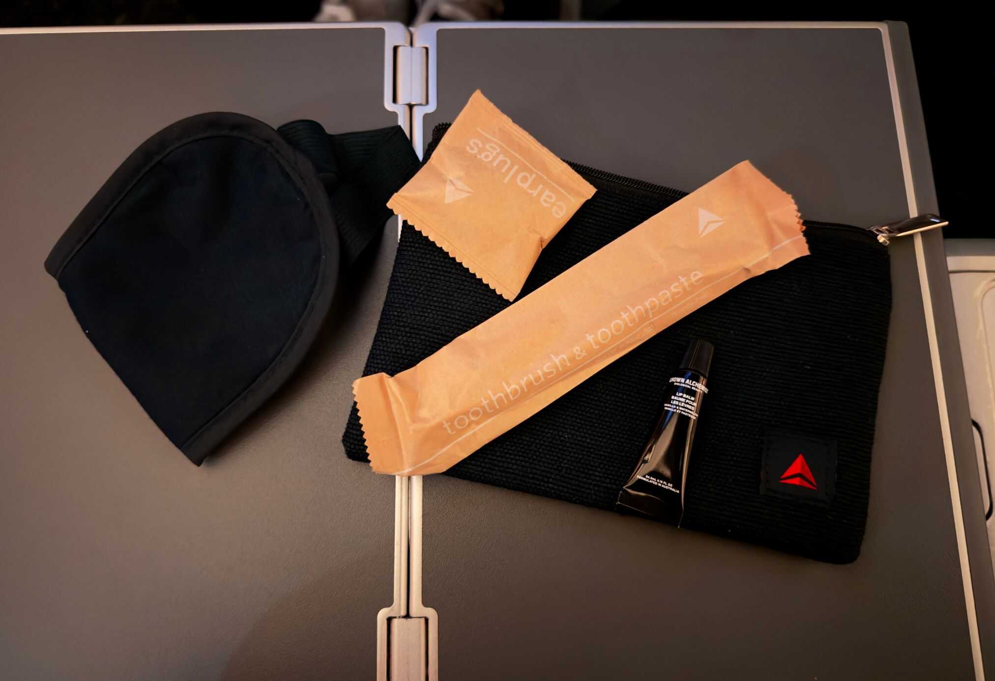 The amenities in Delta's Premium Select include a toothbrush, toothpaste, eye mask, earplugs, and lip balm.