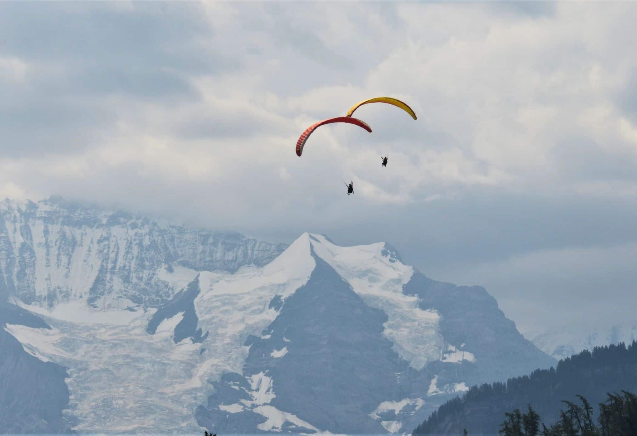 Tandem paragliding is fun year-round in Interlaken, Switzerland. This city is an outdoor lover's dream.